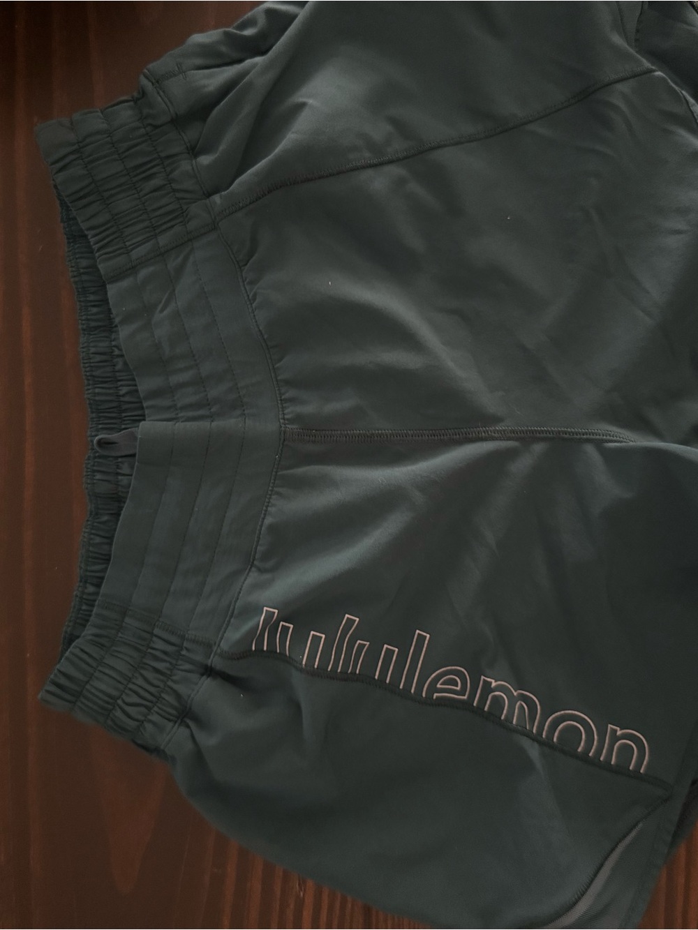 lululemon athletica dark green athletic shorts with logo